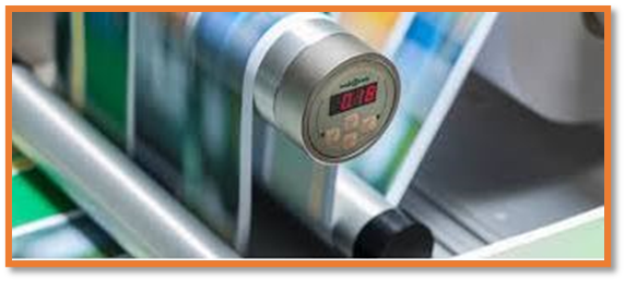 Web tension sensor mounted on a printing press showing live tension readout